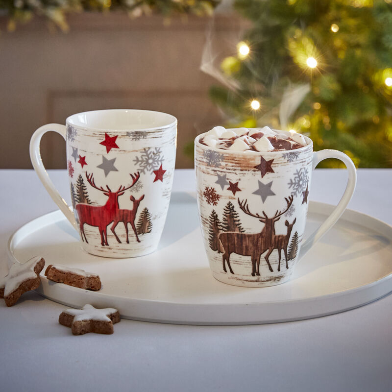 Jolies tasses de Noël aux motifs de rennes pour savourer chocolat chaud, thé, café ou vin chaud